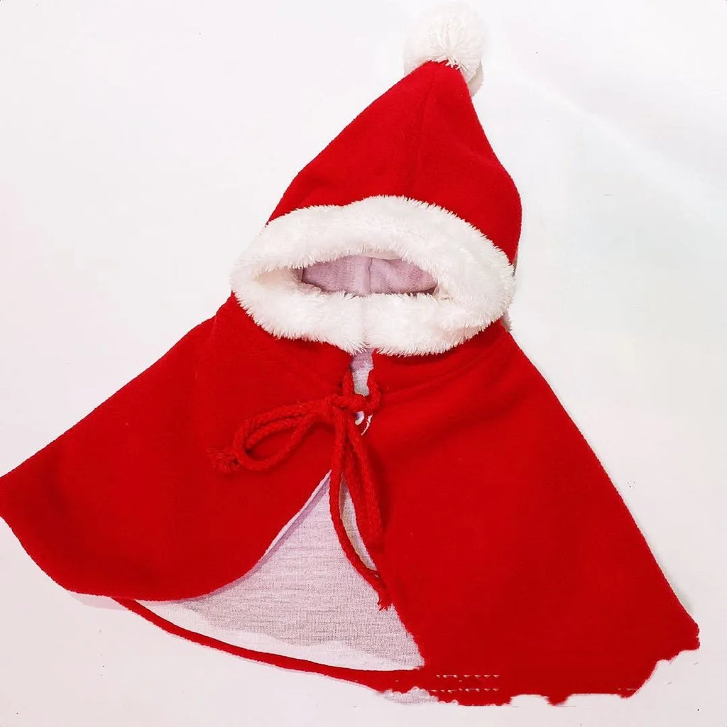 Red Christmas cloak shawl clothing on a small dog with holiday decoration background