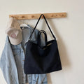 Large capacity women's casual tote bag in khaki cloth with polyester lining, sandwich pocket, and mobile phone bag