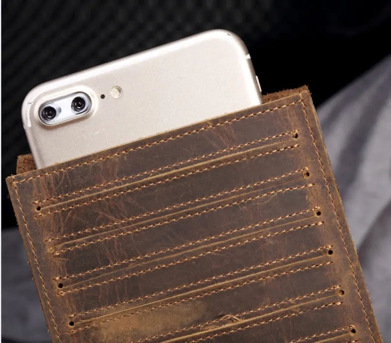 Men's long leather wallet open showing 18 card slots, cash compartment, and phone pocket.