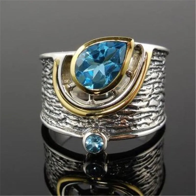 Women's blue zircon inlay ring in creative Chinese style drop shape design on alloy band