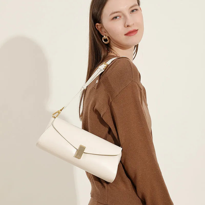 Women's cowhide leather cross-body bag in clamshell design with internal organisers