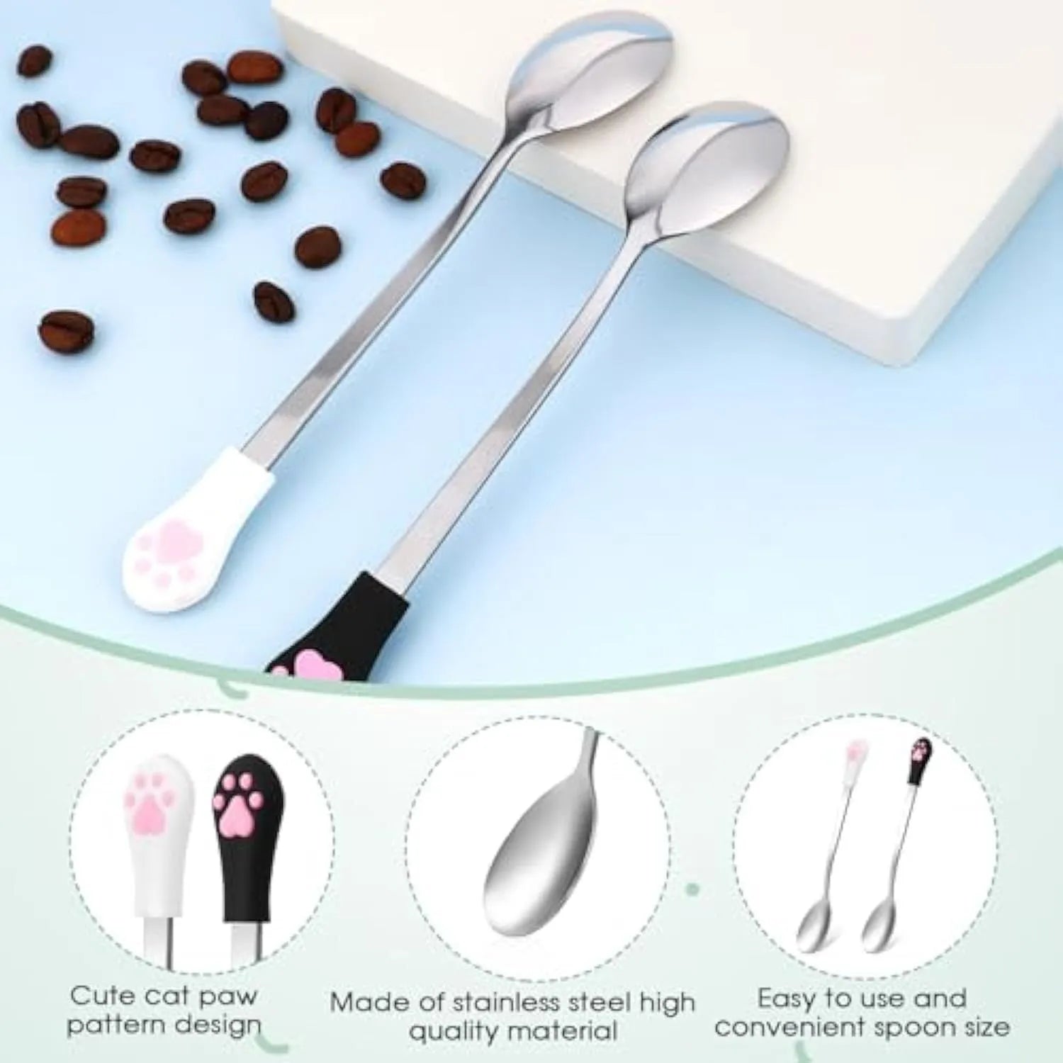 White and black stainless steel pet food spoons with cat paw design and silicone handles