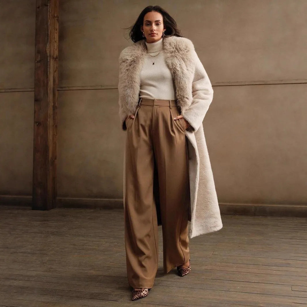 Women's lengthened faux fur coat in camel colour, showing regular sleeves and full-length design.