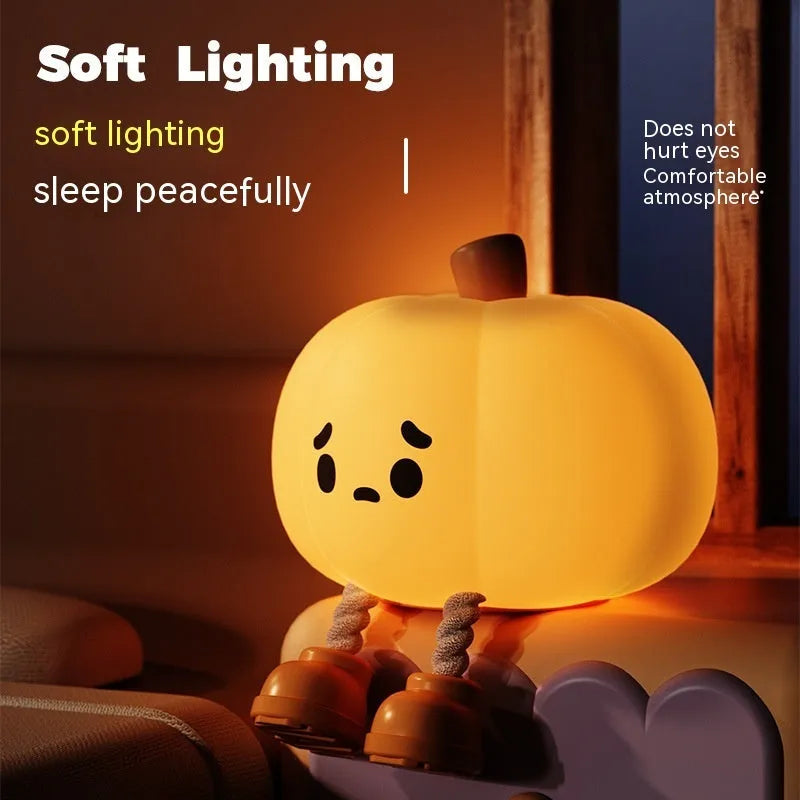 Orange pumpkin-shaped silicone night light with soft glowing illumination