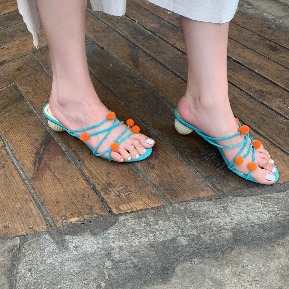 Cyan high-heeled sandals with thin strap lace-up design and open toe made from genuine French leather