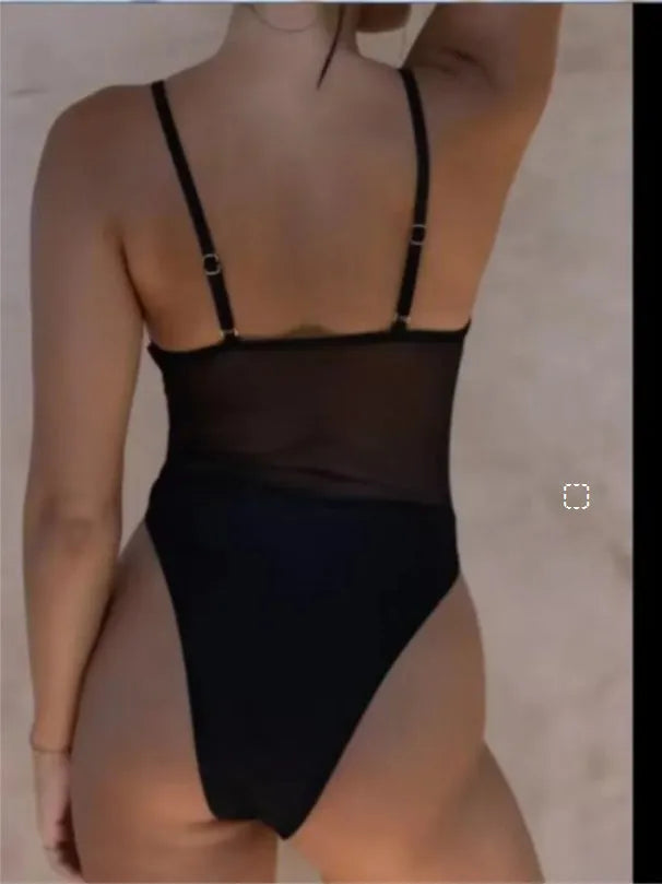 Women's solid black one-piece swimsuit with sleeveless banded bikini style design