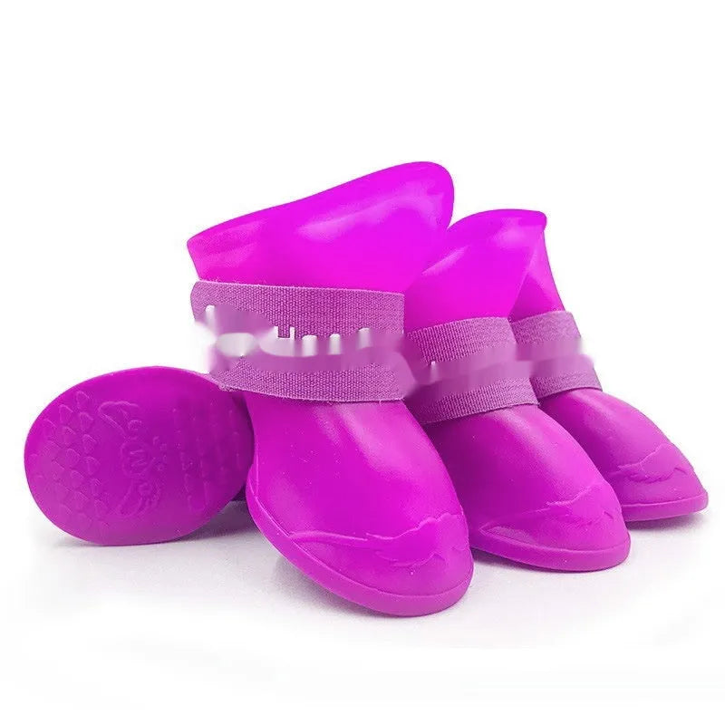 Set of four colourful rubber pet rain shoes with soft soles for dogs or cats.