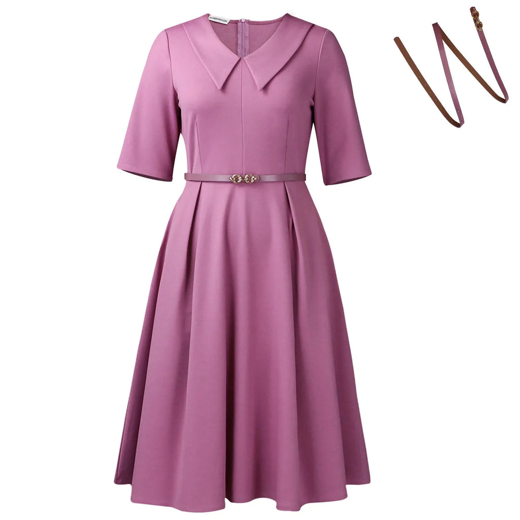 Solid colour African dress with half sleeves and high waist, shown with a matching belt.
