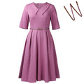 Solid colour African dress with half sleeves and high waist, shown with a matching belt.