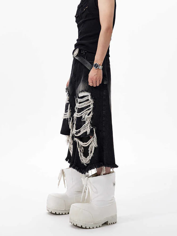Black women's cropped wide-leg jeans with ripped patch detail on mid-high waist.