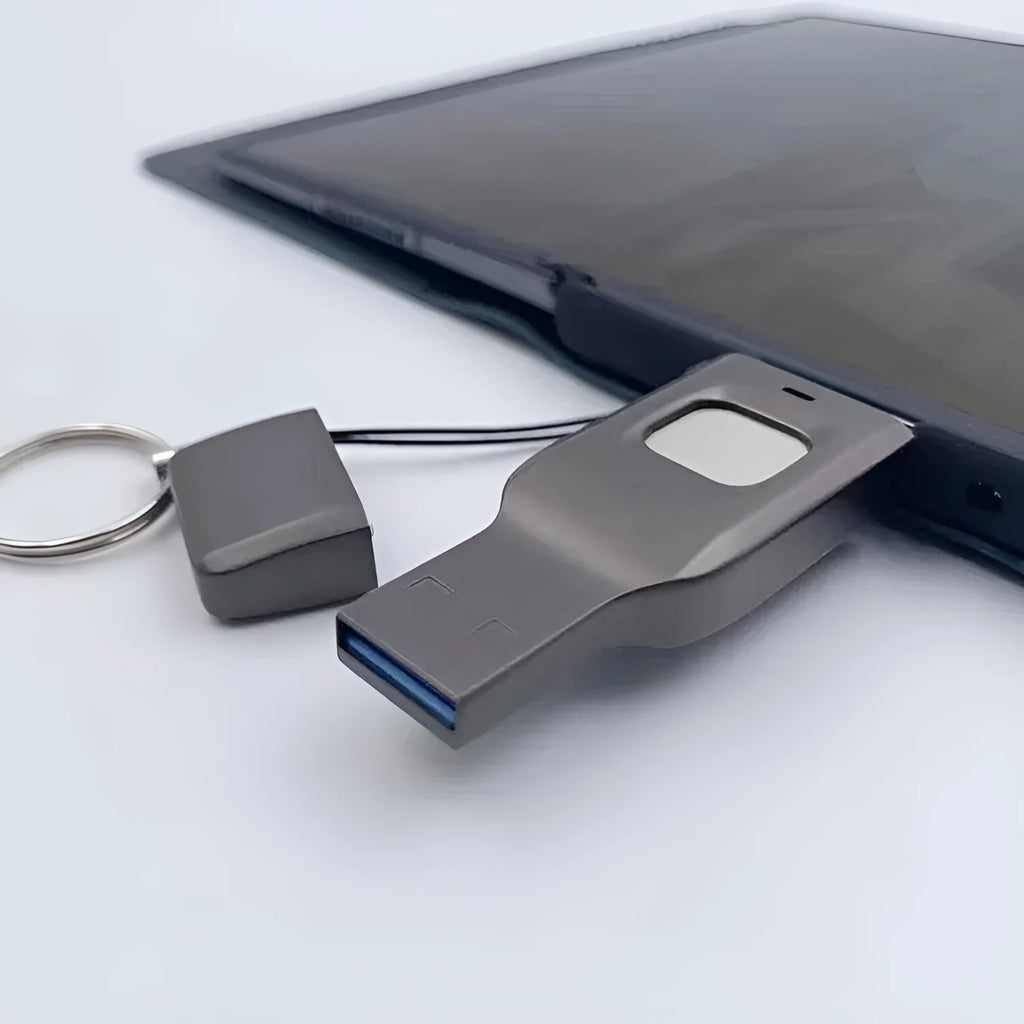 Black fingerprint encrypted USB drive with USB 3.0 and USB-C interfaces showing metal construction