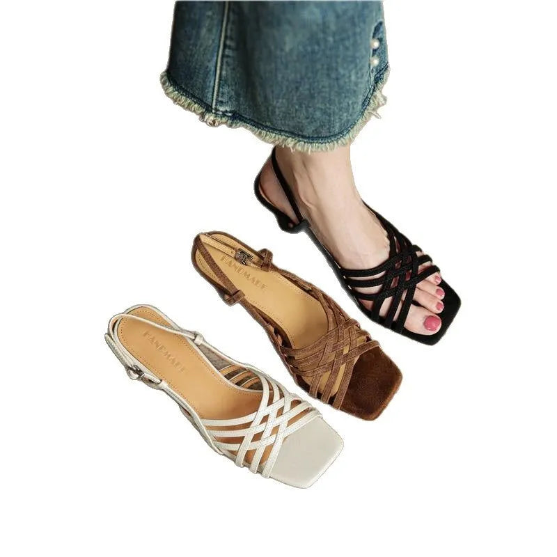 Retro soft leather thin cross strap high heel sandals fastened with an ankle buckle.