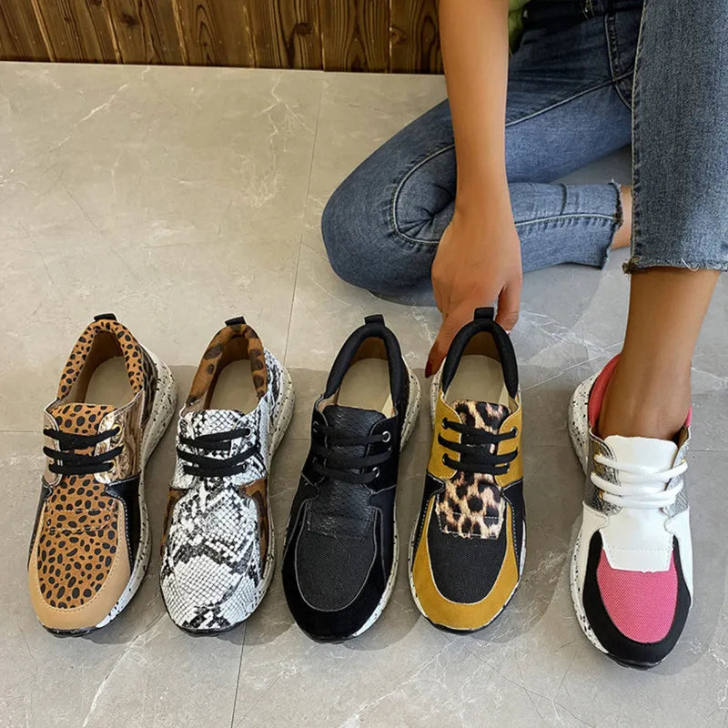 Women's casual suede sneakers with a wedge heel in black, leopard, pink, panther, and snake pattern colours.