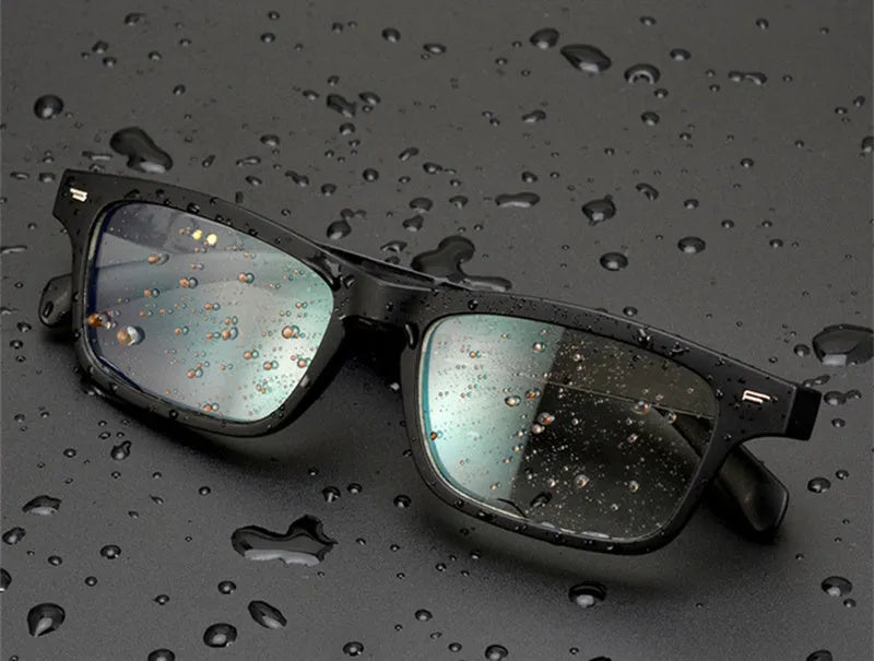 Black smart glasses with Bluetooth open-ear speakers, polarised lenses, and a sporty PC+ABS frame.