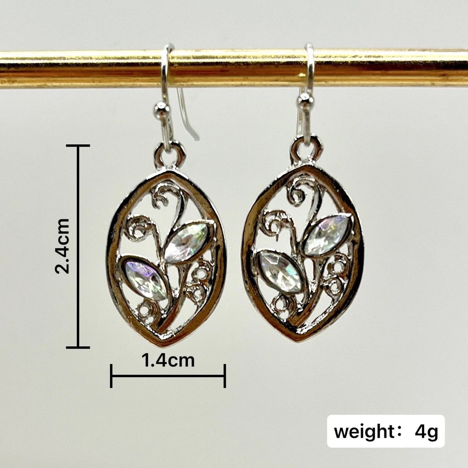Silver colour leaves-shaped earrings with colourful moonstone embedded in centre