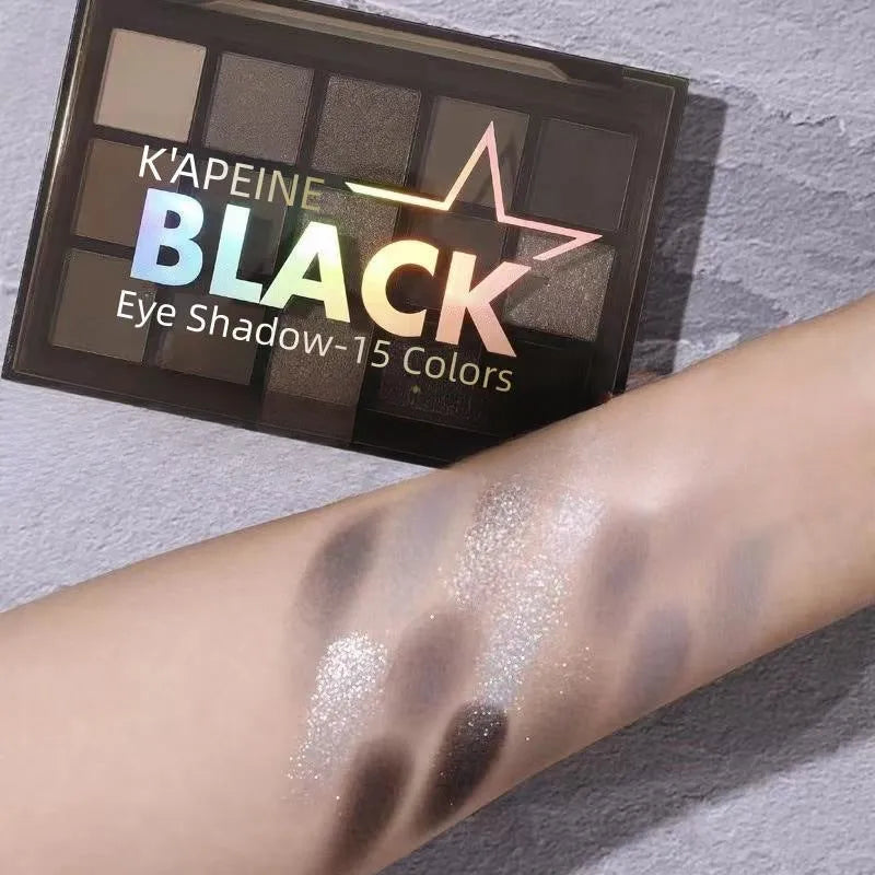 15-colour Night Elf eye shadow palette showing grey, black, and dark matte shimmer shades.