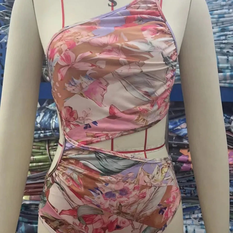 Rose gold patterned women's one-piece swimsuit on a mannequin.