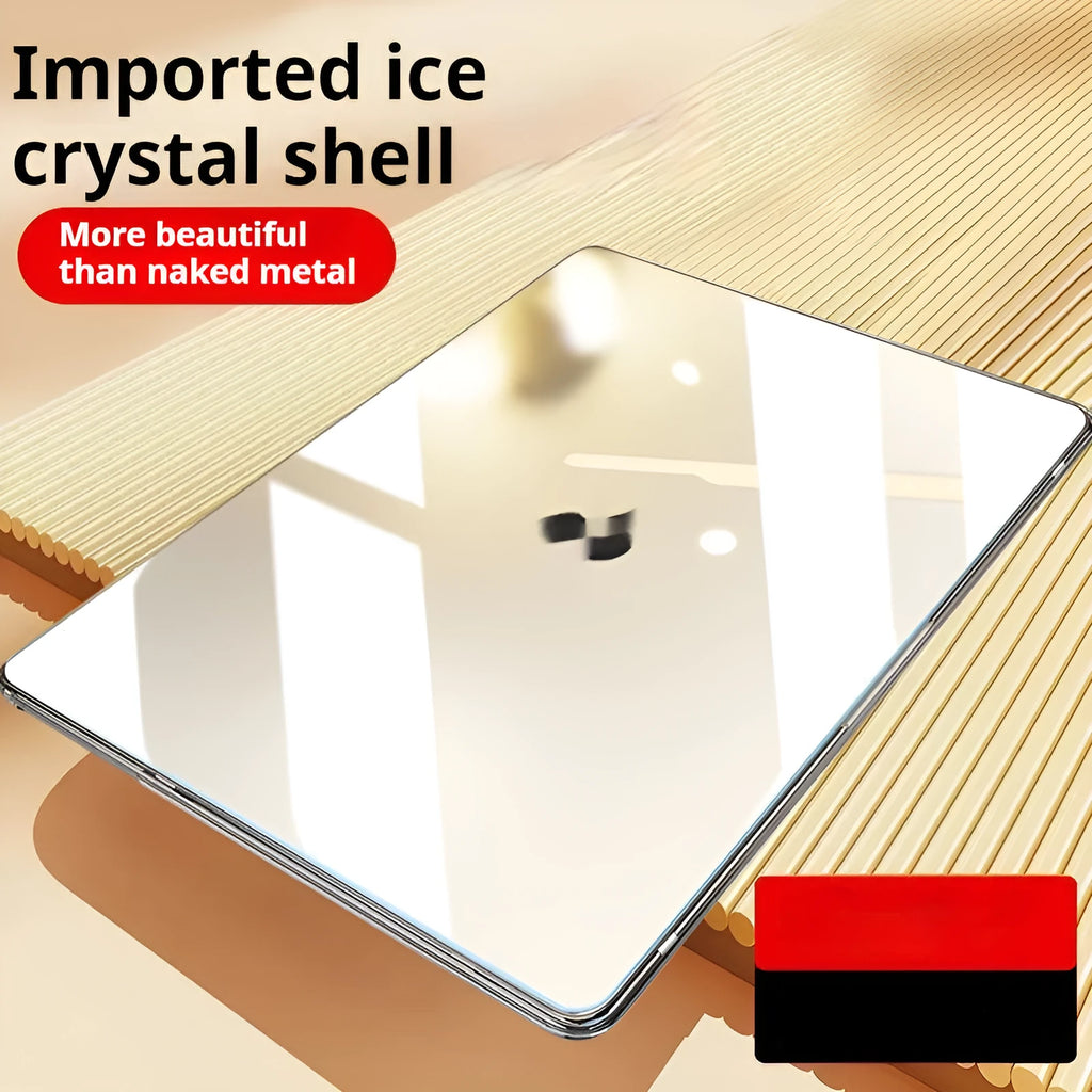 Transparent plastic protective shell for a MacBook laptop on a table.
