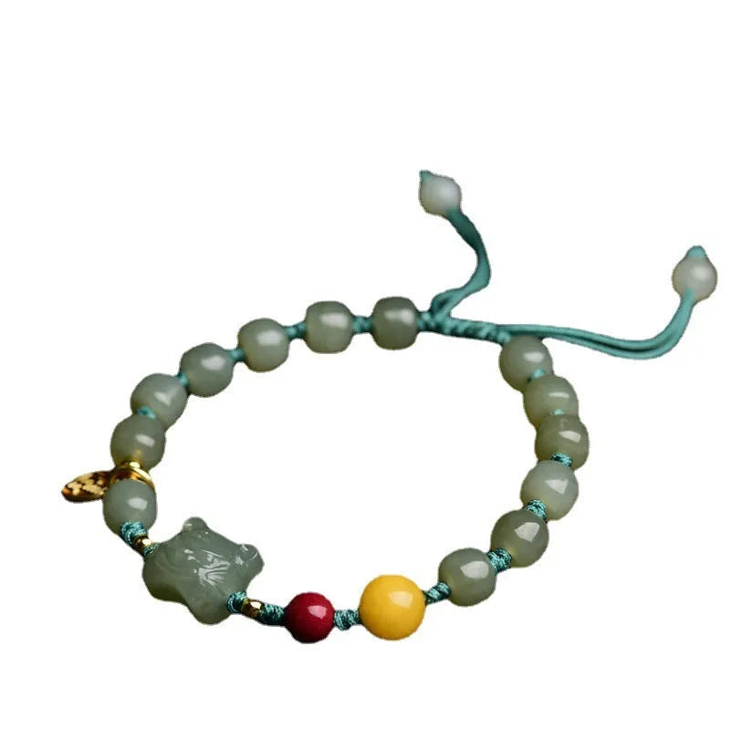 Natural Hetian Jade bracelet with cinnabar and beeswax beads in animal zodiac design.