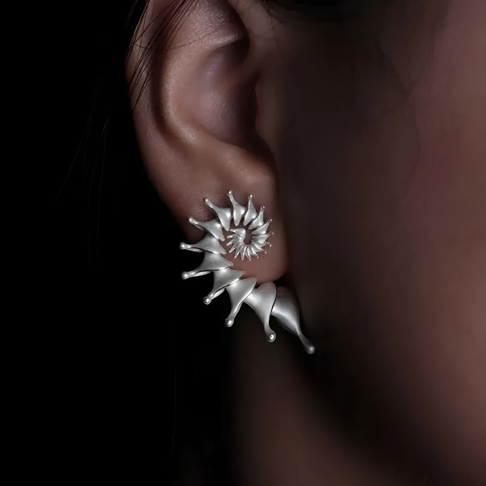 Exaggerated three-dimensional conch stud earrings with matte electroplated alloy finish