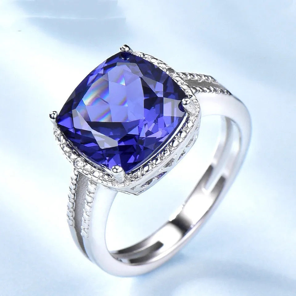 Blue Tanzanite gemstone set in a polished sterling silver women's ring.