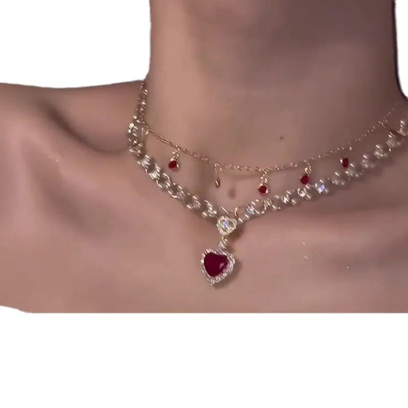 Red love heart and pearl charm on a double-layer adjustable alloy necklace.