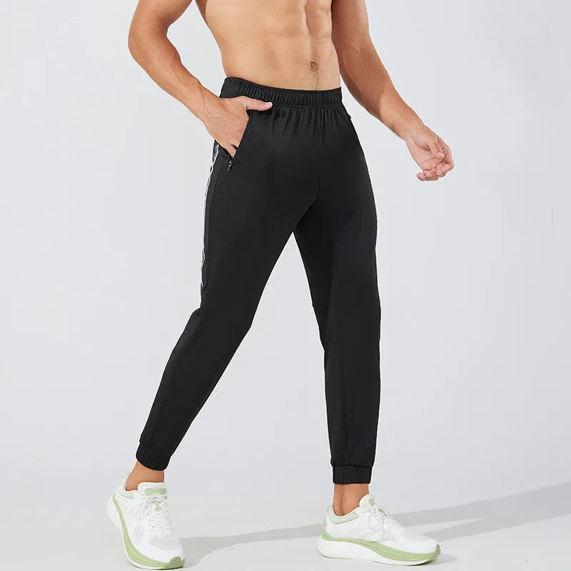 Black and navy blue men's polyester running trousers with mid waist.