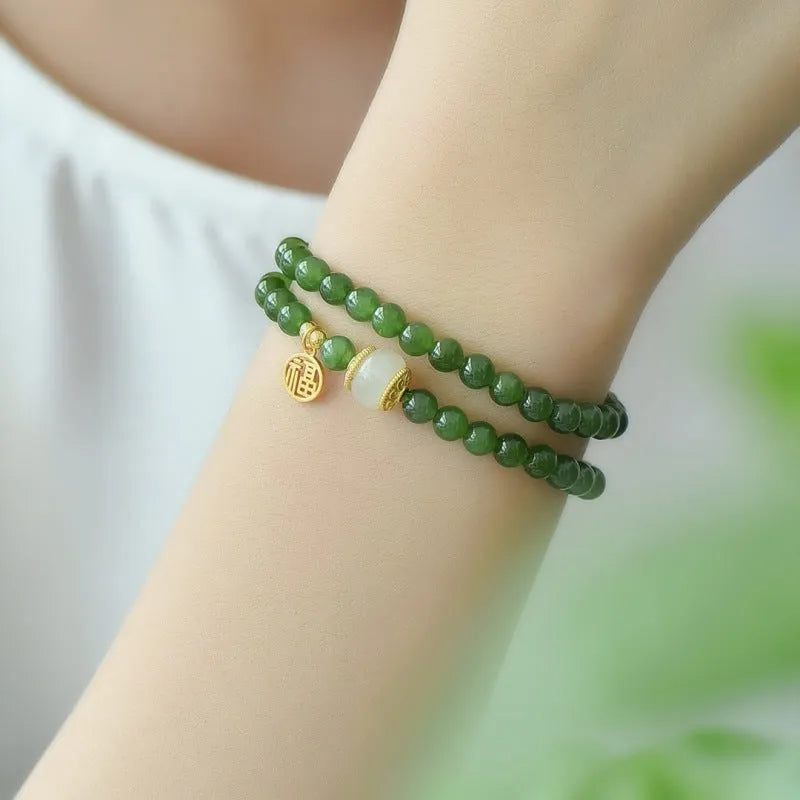 Double circle Hetian jade bracelet with geometric design and fu character elements
