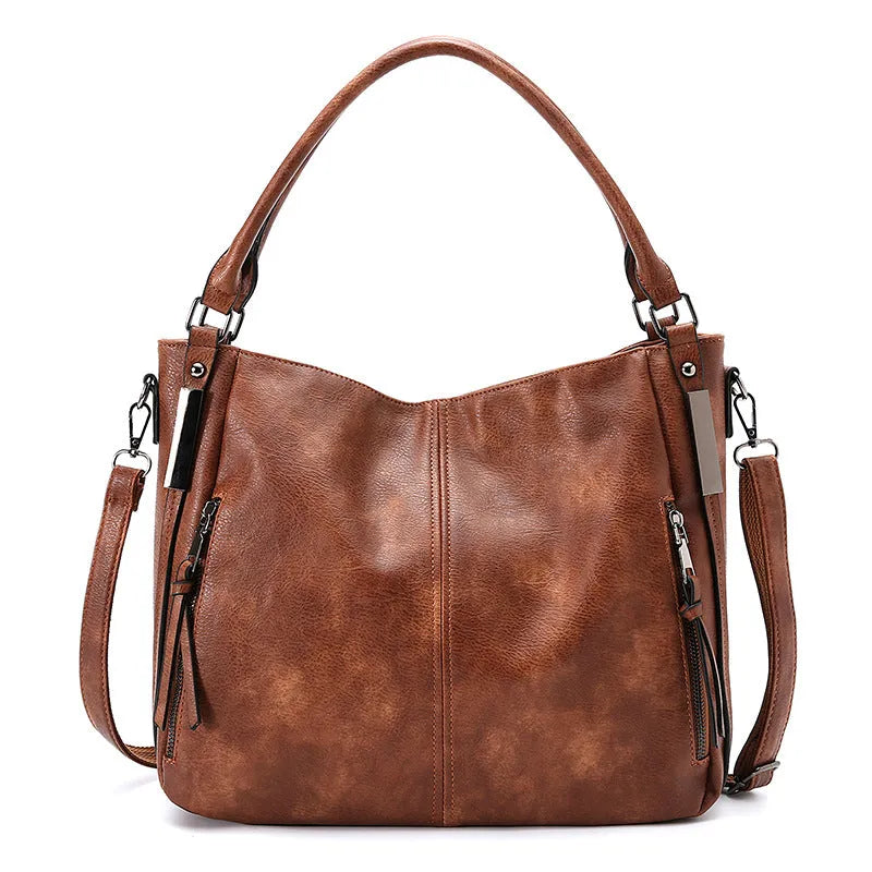 Soft PU crossbody shoulder bag in khaki with metal accent and double strap connectors on a white background