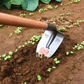 Agricultural pointed hoe with a flat blade, made from manganese and stainless steel.