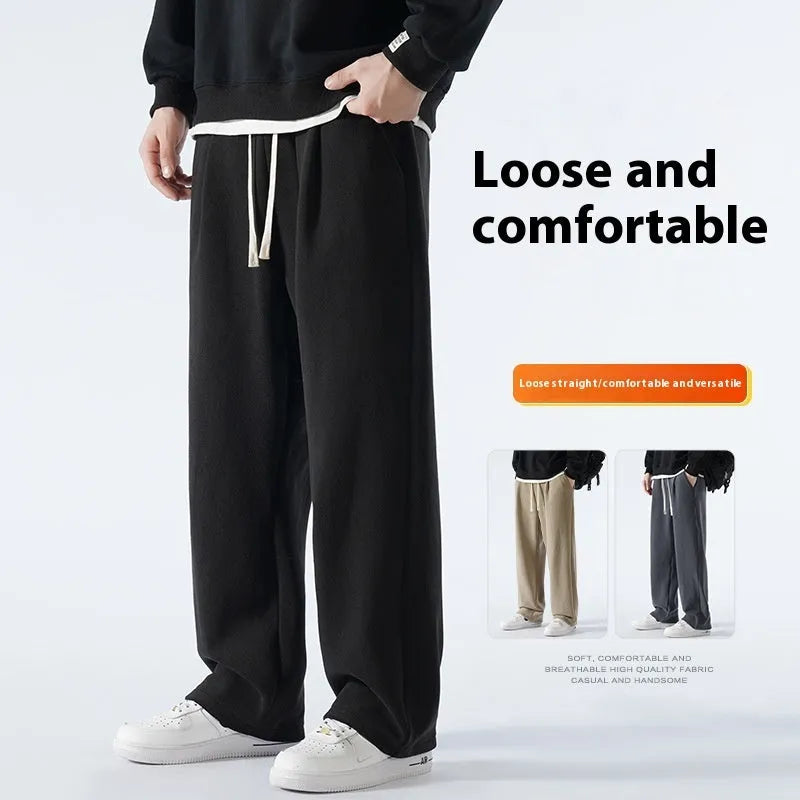 Men's apricot coloured loose-fit polar fleece-lined casual winter trousers on a white background.