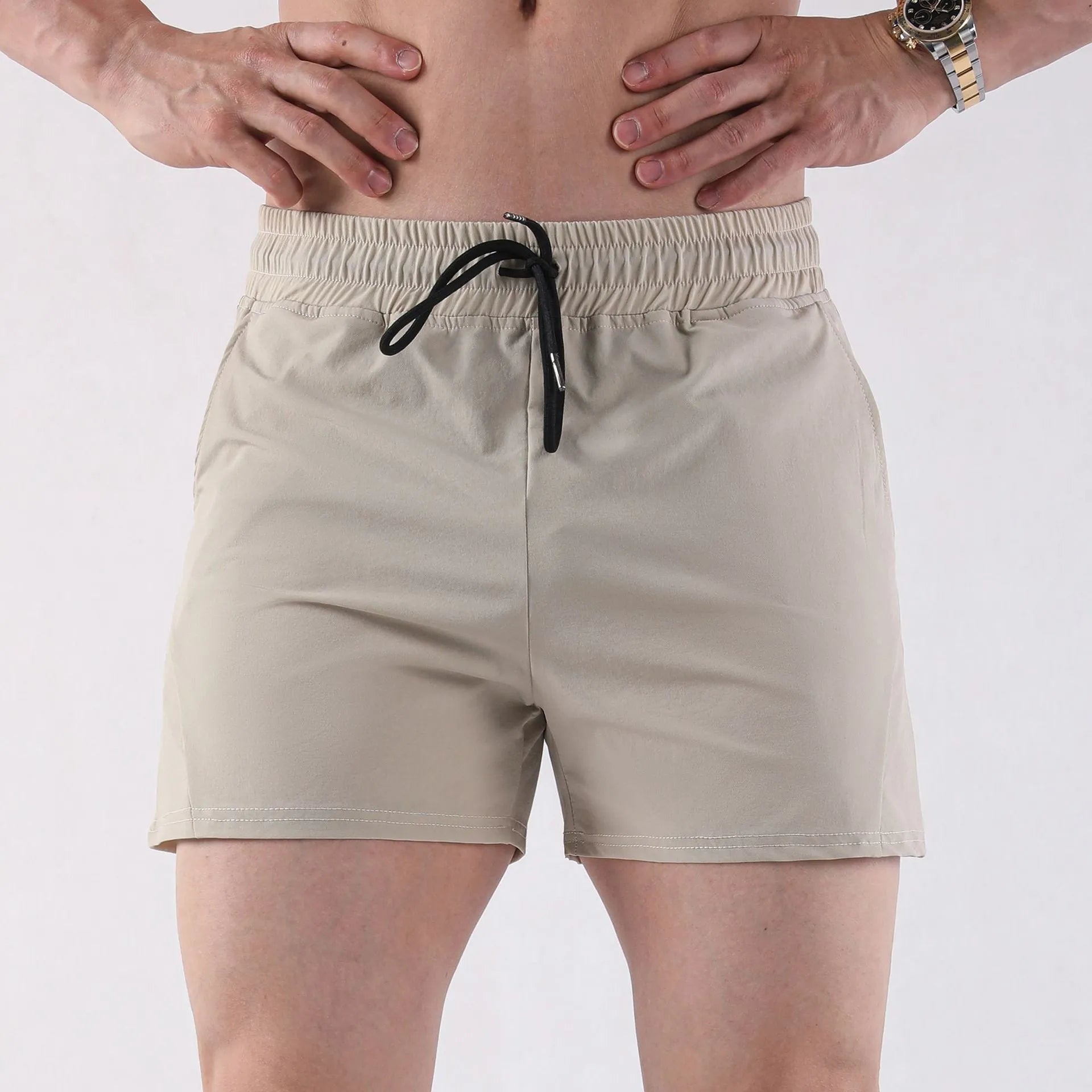 Men's grey polyester basketball shorts with elastic waistband shown front and back
