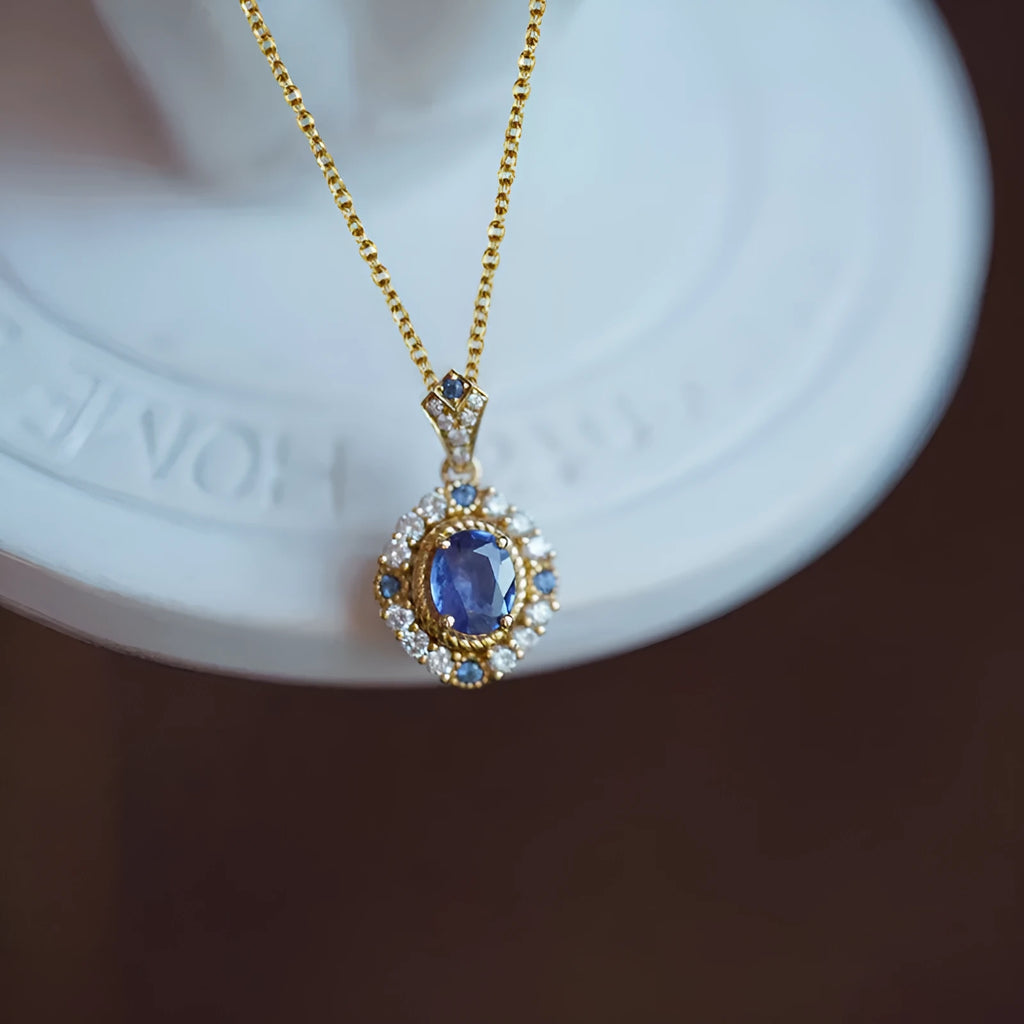 Yellow gold coloured copper necklace with a mixed gemstone pendant and box chain.