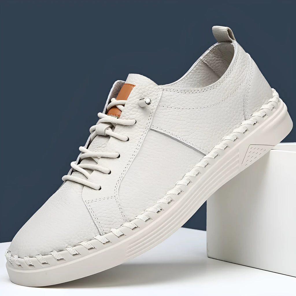 Men's beige cowhide leather casual sneakers with round toe and visible stitching.