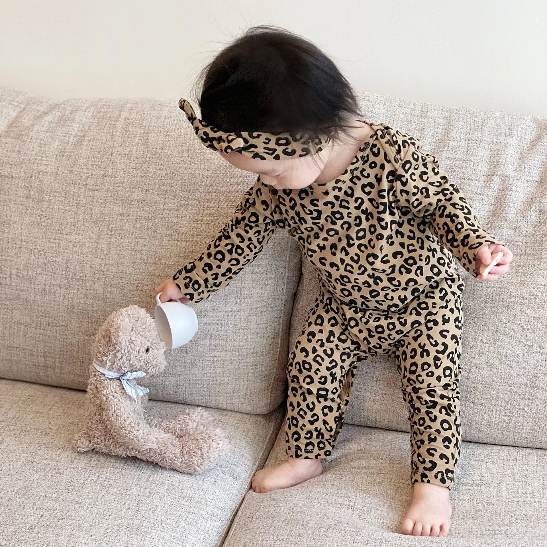 Brown leopard print cotton long-sleeved baby jumpsuit with matching headband