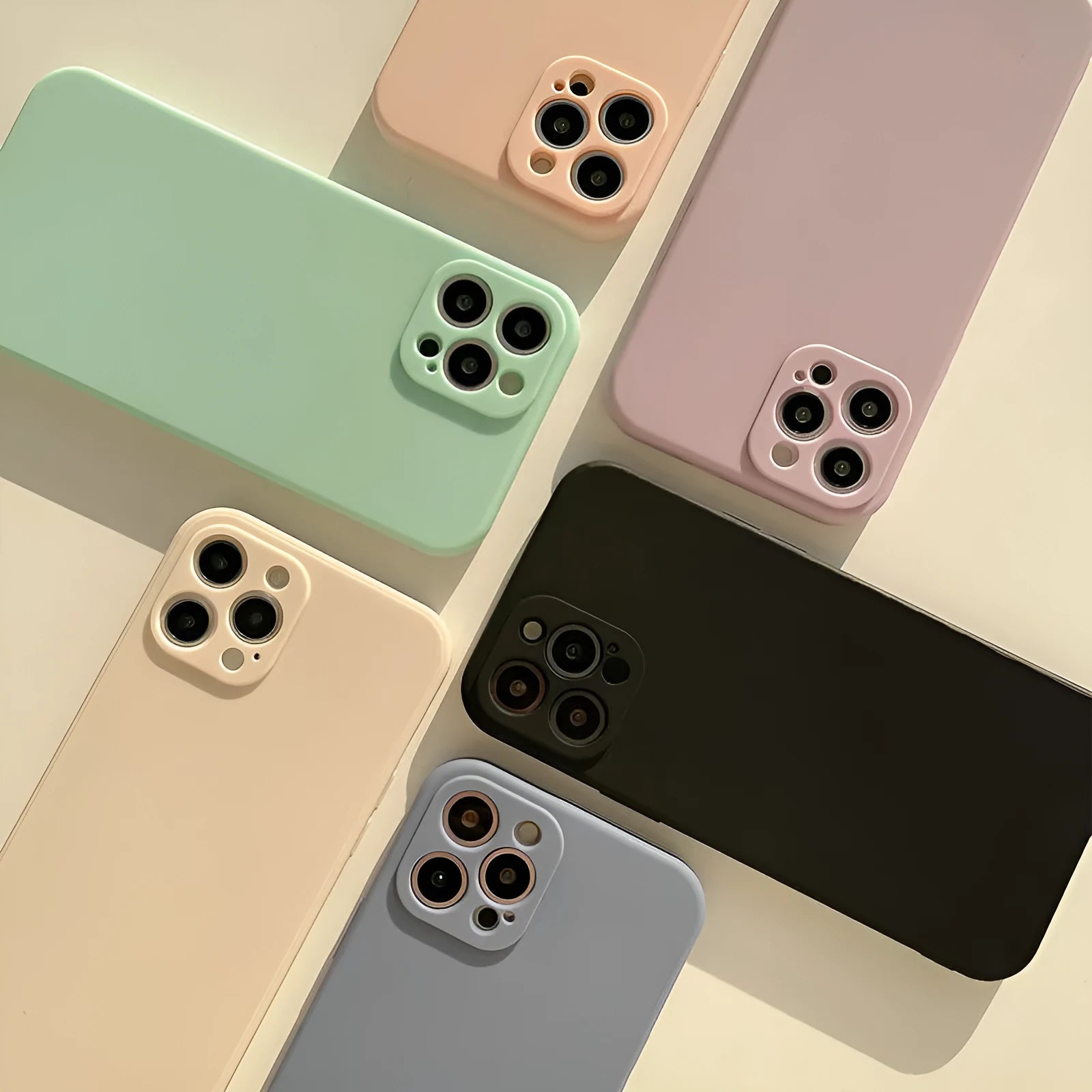 Frosted solid colour TPU phone case for iPhone 14 models shown in various colours.