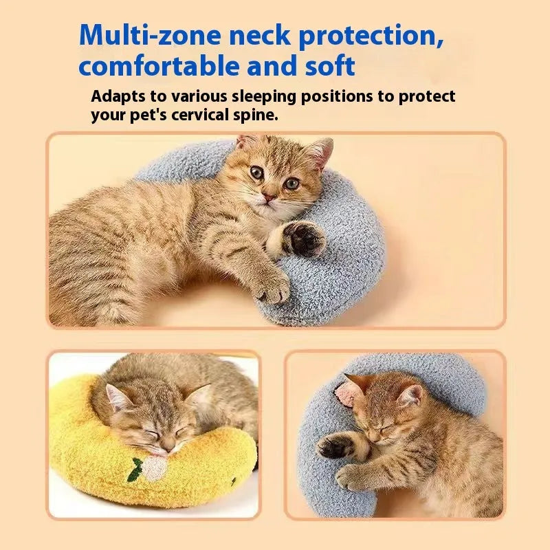 Blue and yellow U-shaped cat neck protection pillows in moon and question mark styles on a white background.