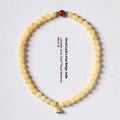 Yellow jade handmade double ring bracelet showing hand-woven texture and retro style
