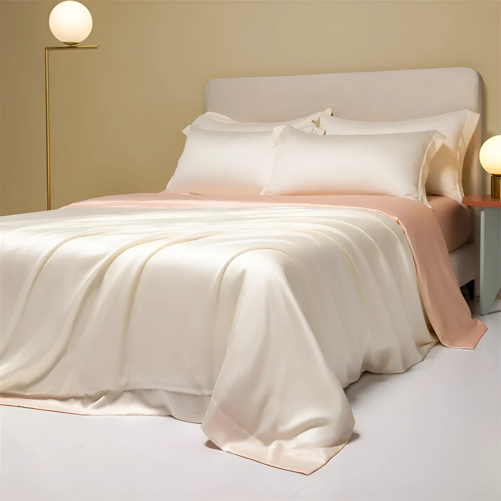 A modern Lenzing Tencel bedding set with a quilt cover and pillowcases in a neutral colour, laid flat on a bed.