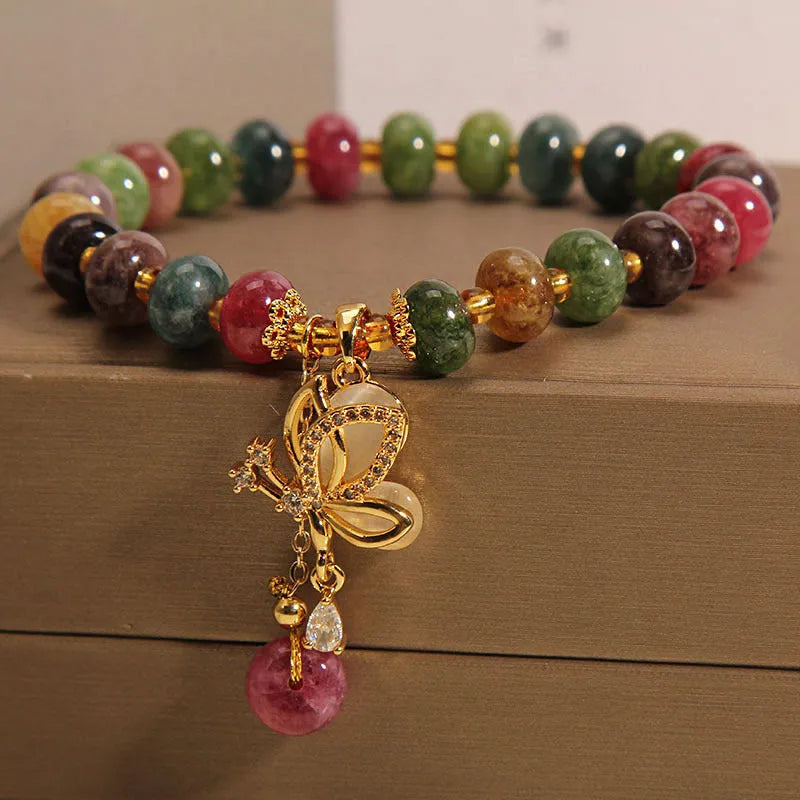 Colourful women's bracelet with a silver butterfly charm and multicoloured beads including tourmaline