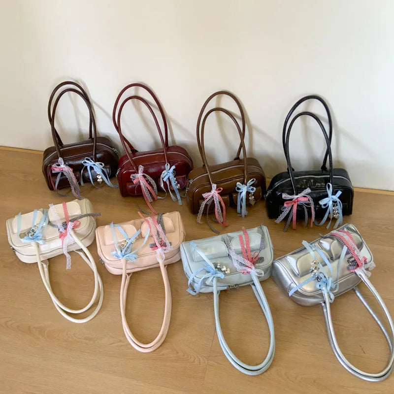 Niche single shoulder bag for women in PU pillow shape, showing internal pockets and available colour options