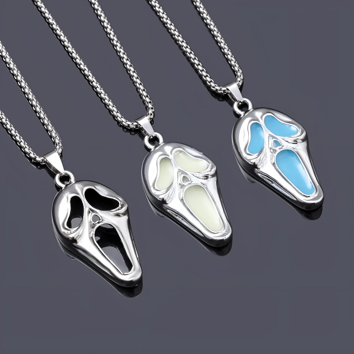 Exaggerated skull luminous mask pendant necklace on square pearl chain, available in luminous blue, luminous green, and hollow out colours