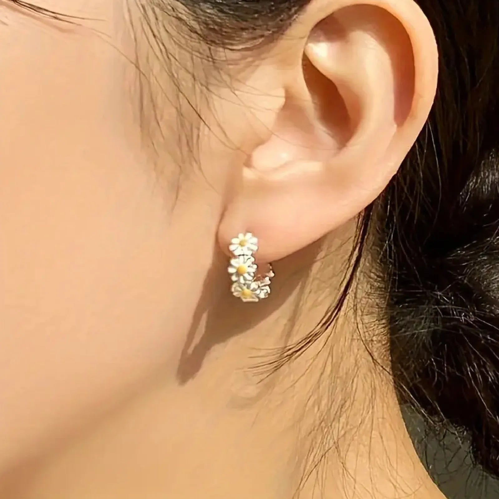 White daisy flower fashion earrings with platinum gem accents on copper base