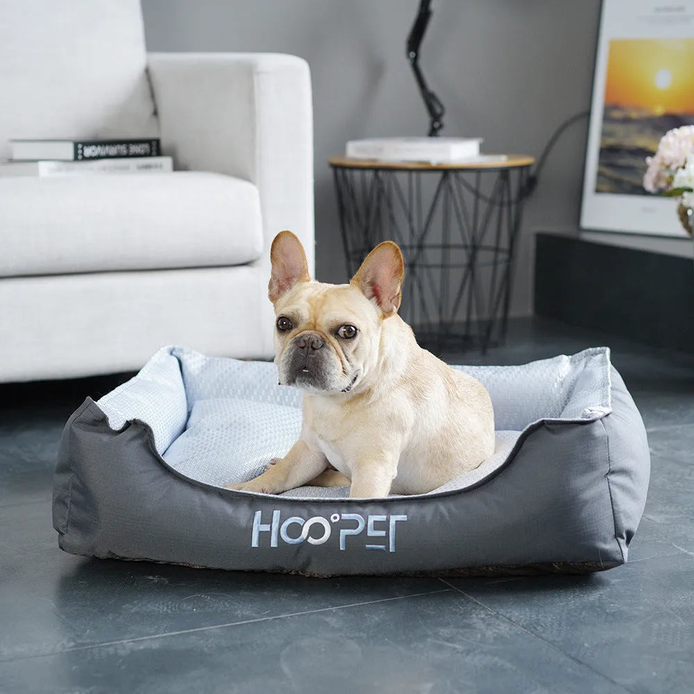 Soft grey dog bed with removable cover in small, medium, and large sizes.