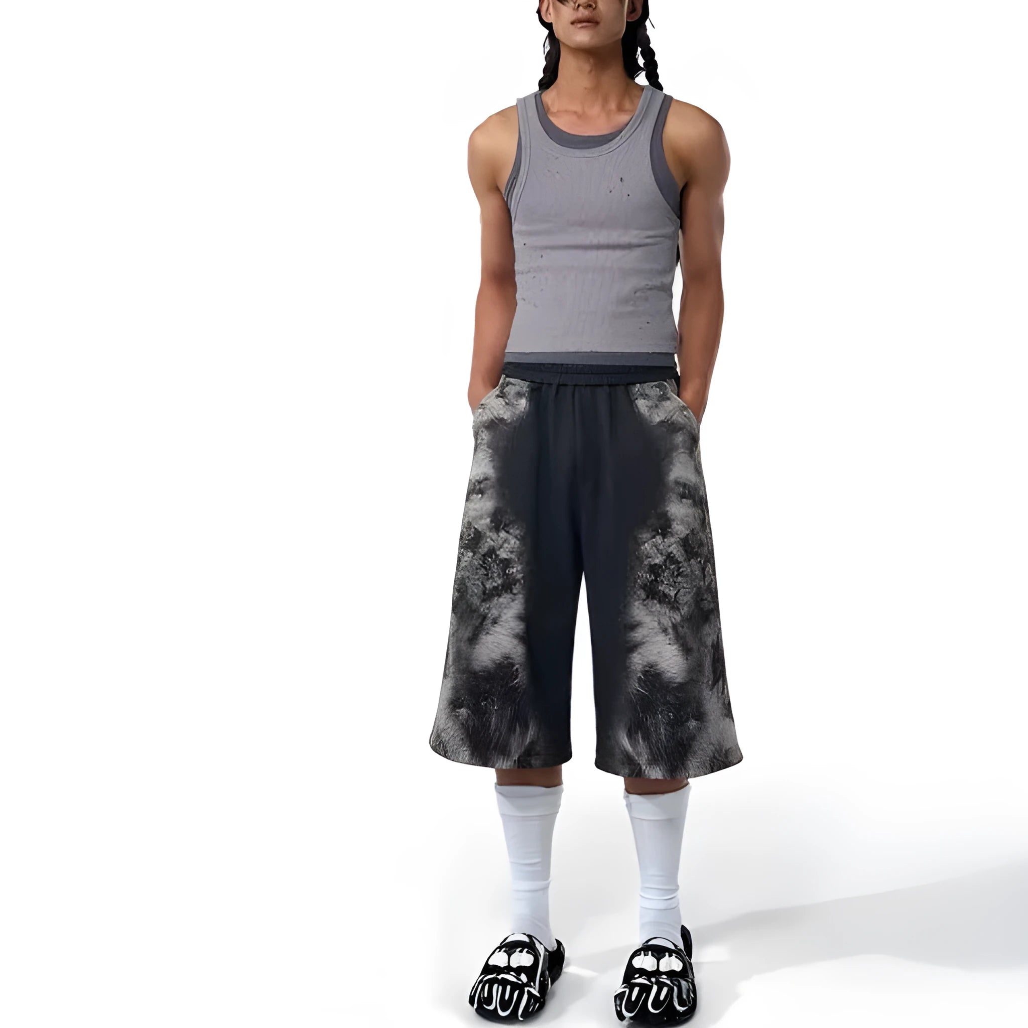 Loose fitting printed casual trousers with a hoodie on a neutral background