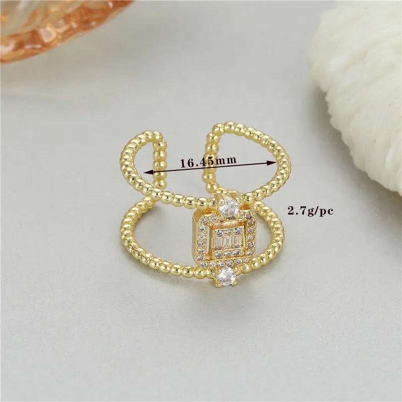 Gold-plated copper open ring with U-shape, adjustable opening, and asymmetrical design.