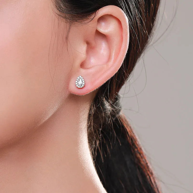 Women's silver drop ear studs in 925 sterling silver with diamond treatment finish