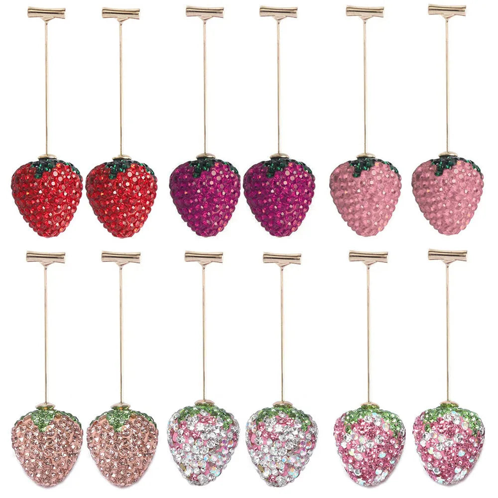 A pair of geometric strawberry-shaped stud earrings with spot drill texture, shown in red zinc alloy.