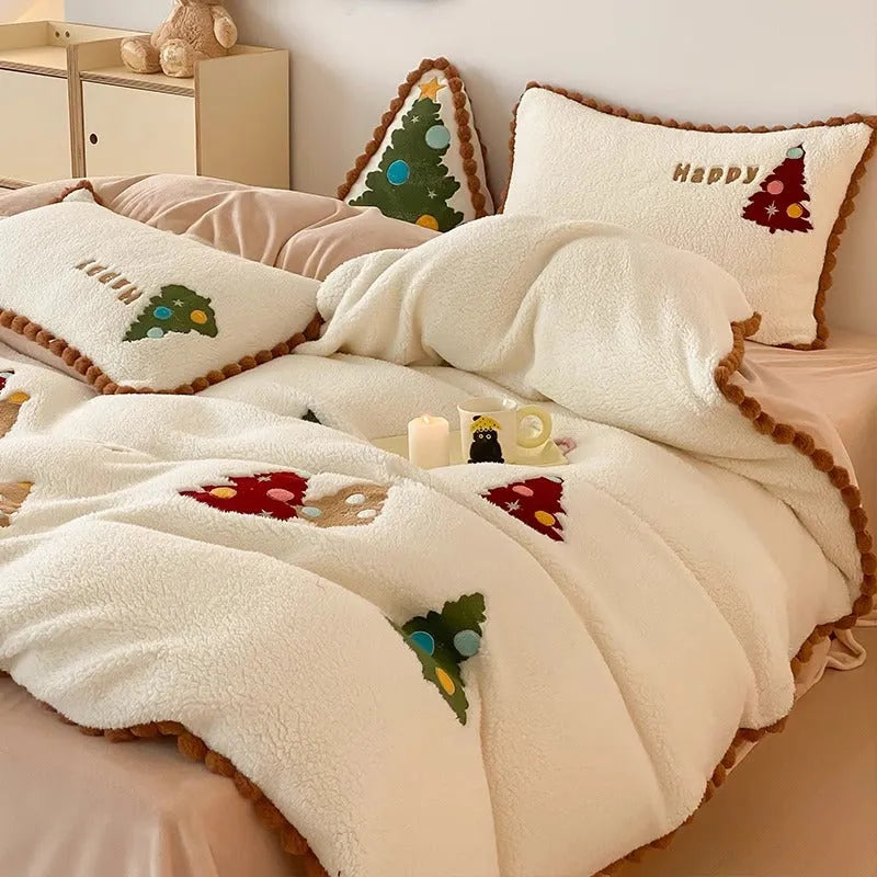 Bright yellow four-piece bedding set with a cartoon Christmas tree pattern, shown on a bed.