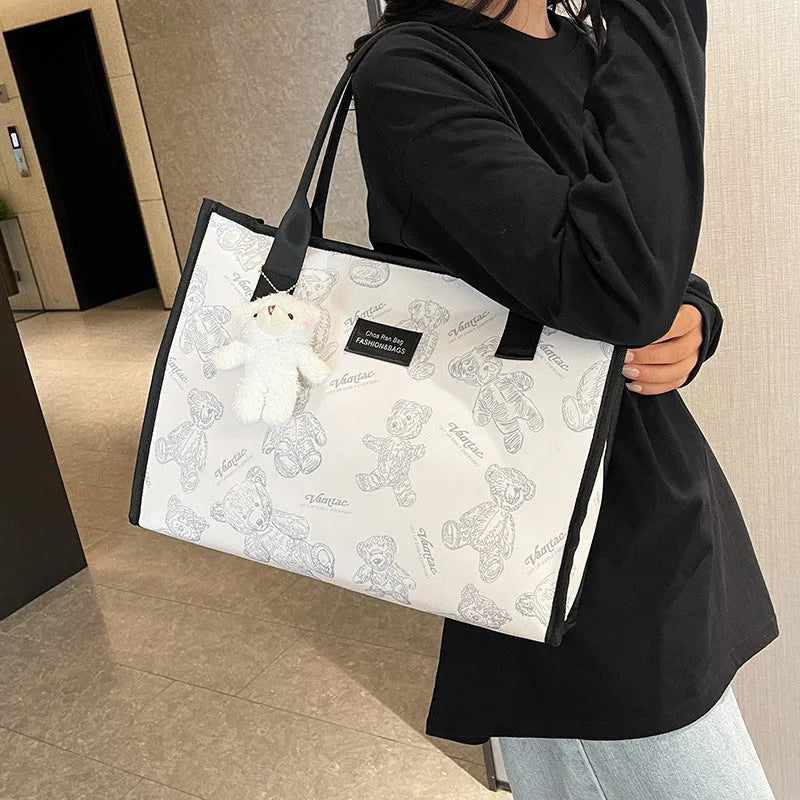 Women's printed canvas tote bag with rhombus pattern and sandwich pockets in black colour option